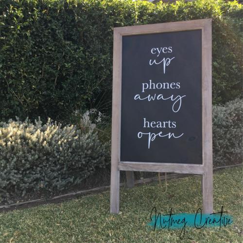 $60 Hire<br>Extra Large A-Frame Chalkboard<br>Unplugged Sign<br>'Eyes Up, Phones Away, Hearts Open'<br>Blank on other side.